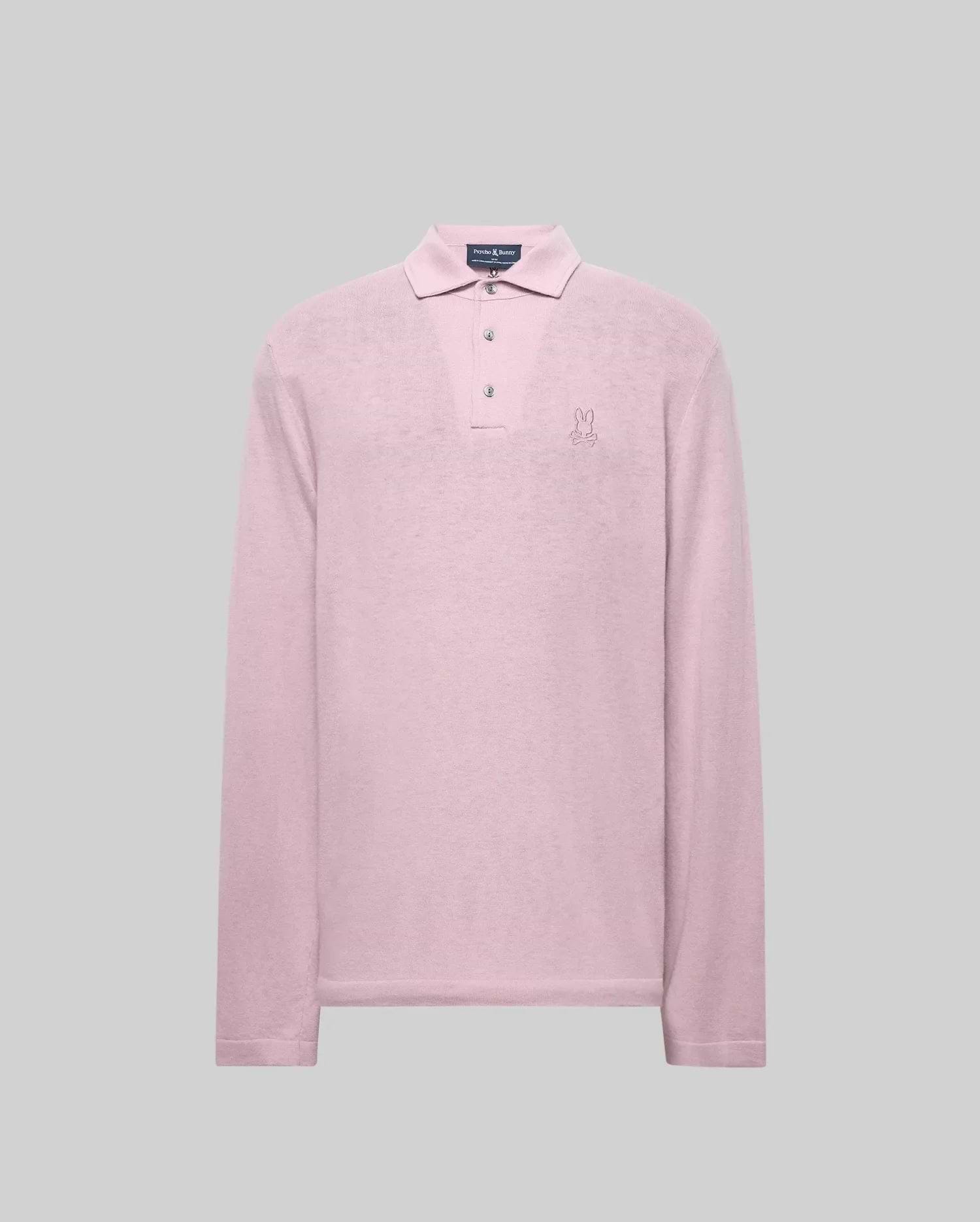 The Psycho Bunny MENS BRADSHAW POLO SWEATER (B6E835D200) is a long-sleeve, light pink merino wool polo with a collar, three mother of pearl buttons, and an embroidered bunny logo on the left chest, shown against a gray background. (5)