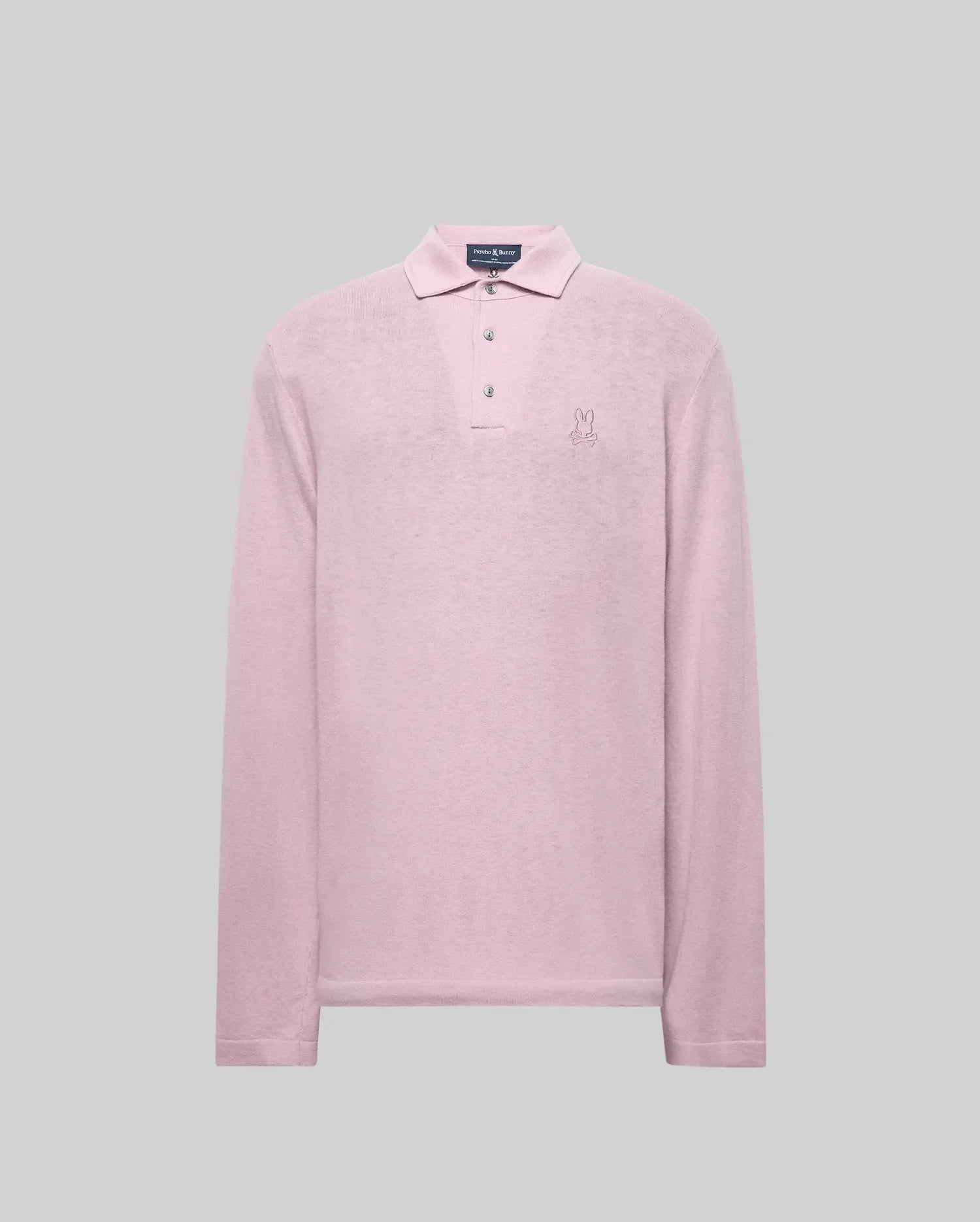 The Psycho Bunny MENS BRADSHAW POLO SWEATER (B6E835D200) is a long-sleeve, light pink merino wool polo with a collar, three mother of pearl buttons, and an embroidered bunny logo on the left chest, shown against a gray background. (5)