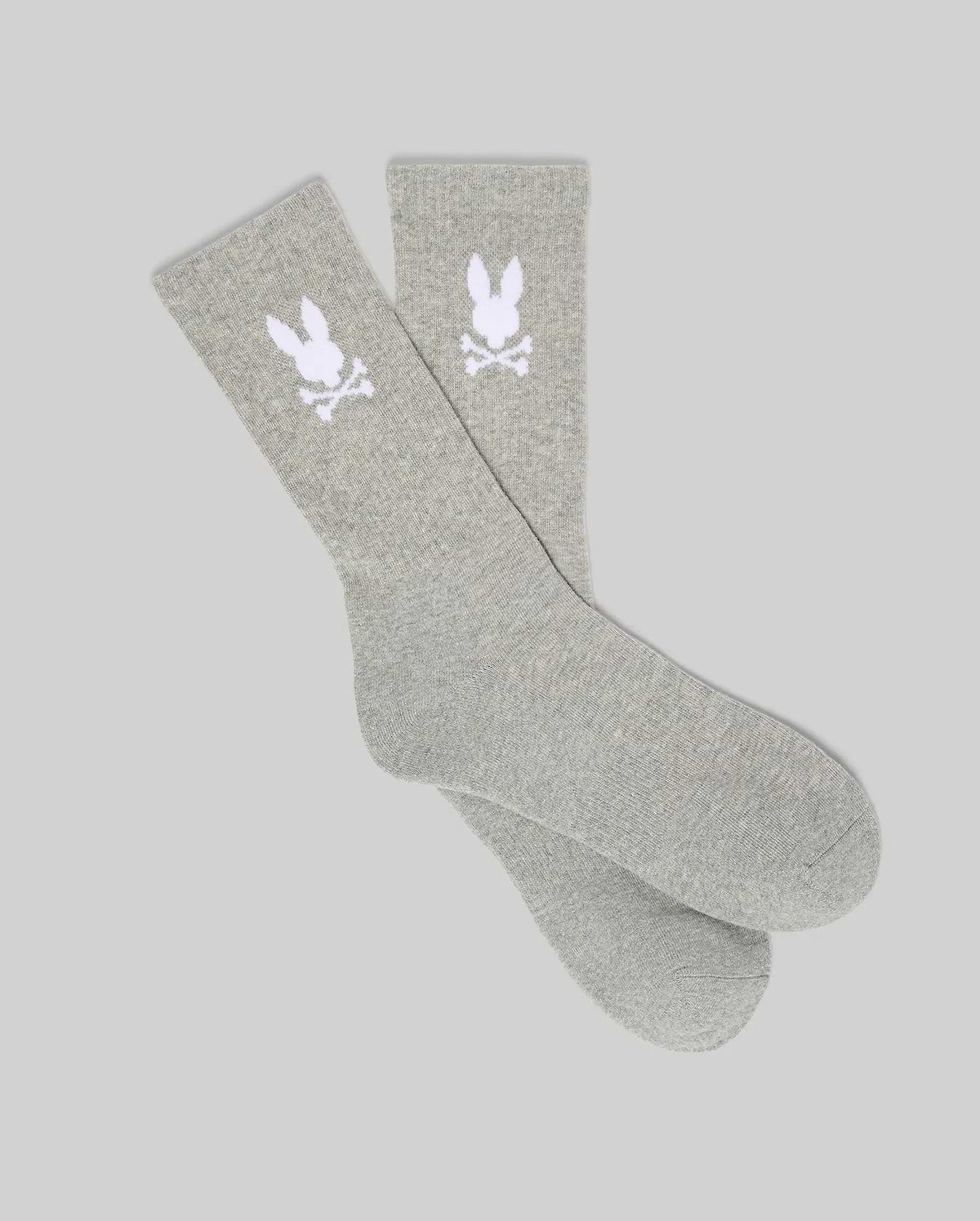 Pair of Grey Mens 3 Pack Sport Sock, featuring a soft knit texture and a prominent white knitted Psycho Bunny skull logo on the ankle cuff of each sock.