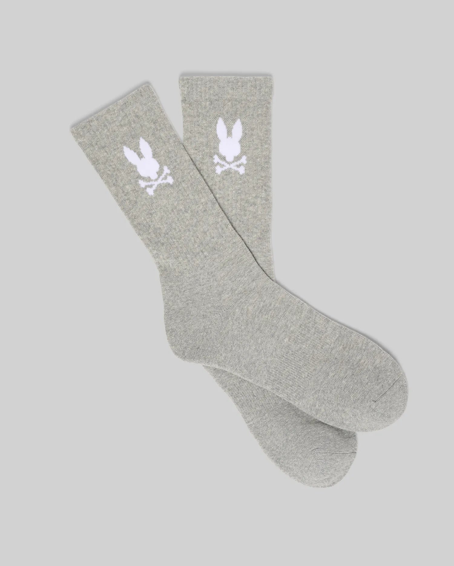 Pair of Grey Mens 3 Pack Sport Sock, featuring a soft knit texture and a prominent white knitted Psycho Bunny skull logo on the ankle cuff of each sock.