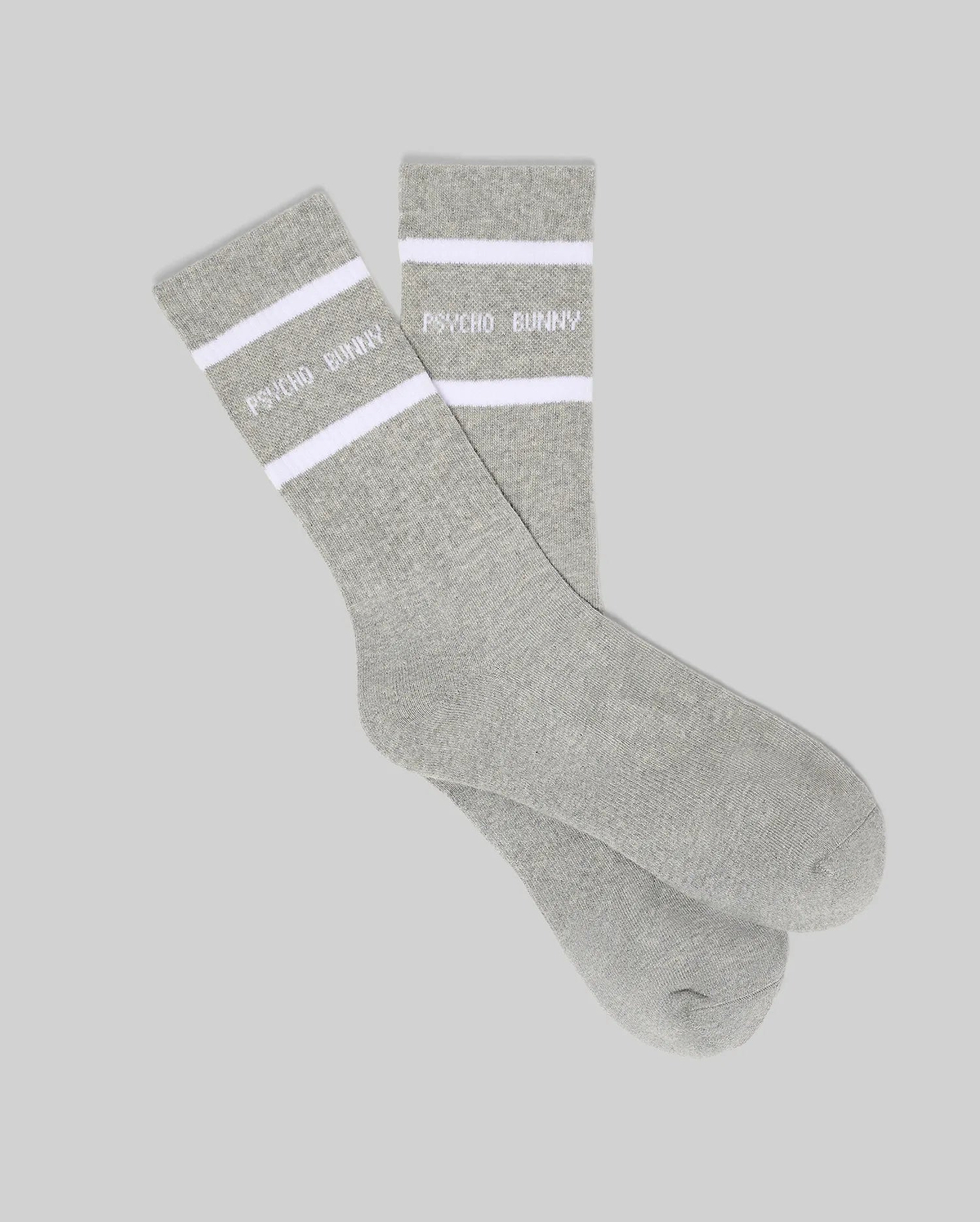 Mens 3 Pack Sport Sock, a premium grey knit sock featuring two bold white stripes and the distinctive white Psycho Bunny text logo prominently displayed on the ribbed cuff.