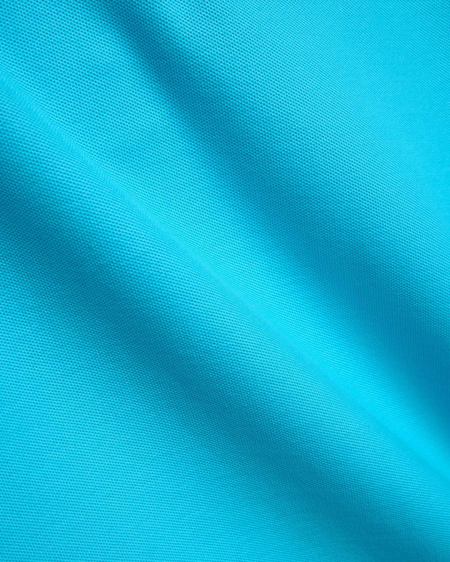 Mens Classic Pique Polo in vibrant turquoise, showcasing its classic pique knit texture, designed with a classic fit and the iconic small embroidered Psycho Bunny skull logo on the chest. (7)