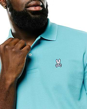 Men's Classic Pima Pique Polo in vibrant aqua, featuring a classic fit, textured pique fabric, and a small embroidered Psycho Bunny skull and crossbones logo with pink ears on the left chest. (3)