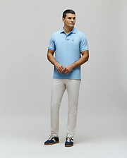 MENS CLASSIC PIQUE POLO in light blue, featuring a classic fit and pique knit texture. Small embroidered white Psycho Bunny skull logo on the left chest.
