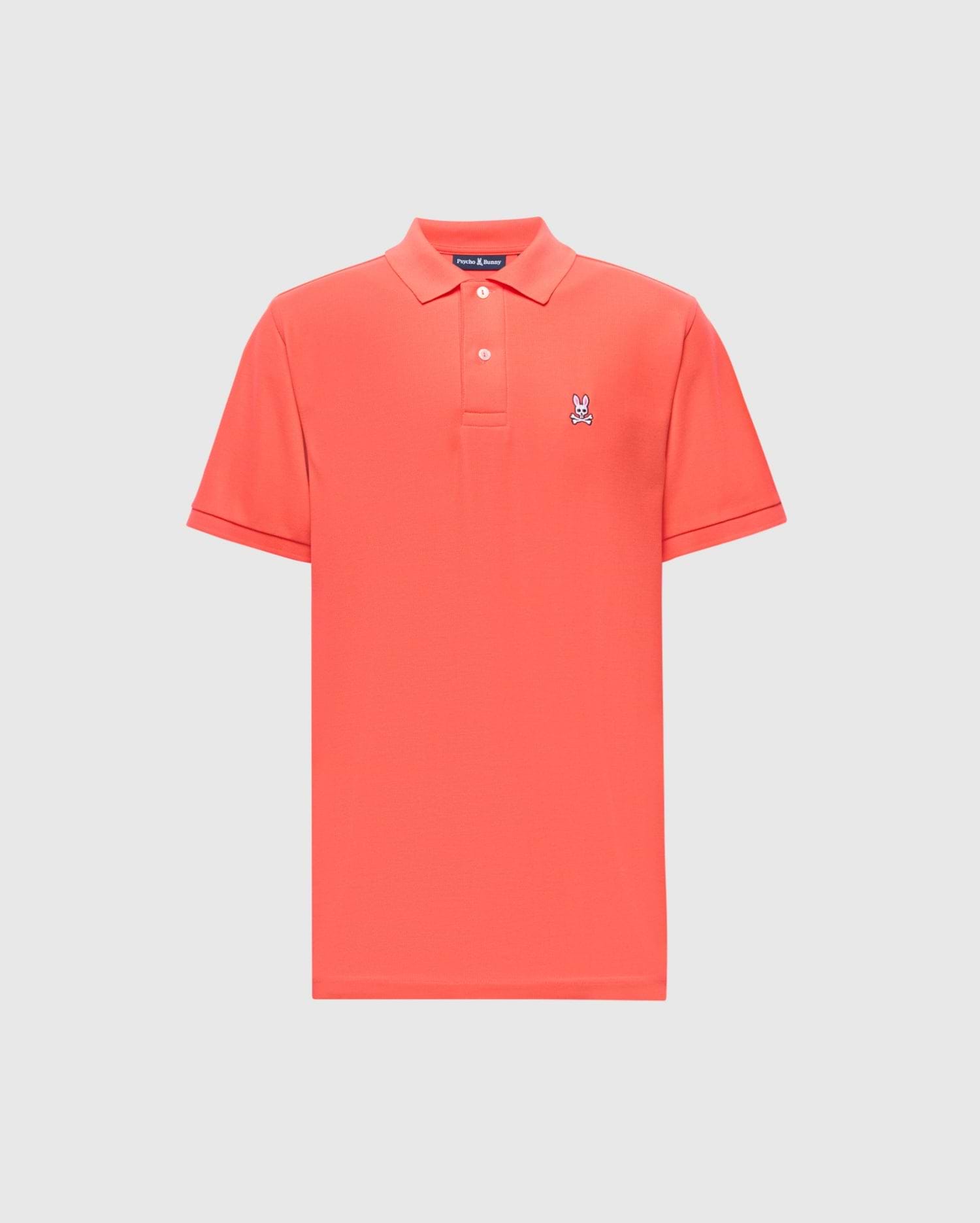 The Psycho Bunny MENS CLASSIC PIQUE POLO - B6K001F200 is a red shirt featuring a traditional collar and short sleeves, made from premium Pima cotton with an embroidered Bunny logo on the left chest, set against a plain white background.