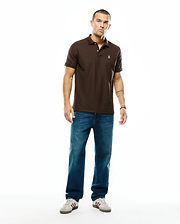 Men's Classic Pima Pique Polo in rich brown, featuring a classic fit, two-button placket, and a small embroidered white Psycho Bunny skull logo on the left chest. (5)