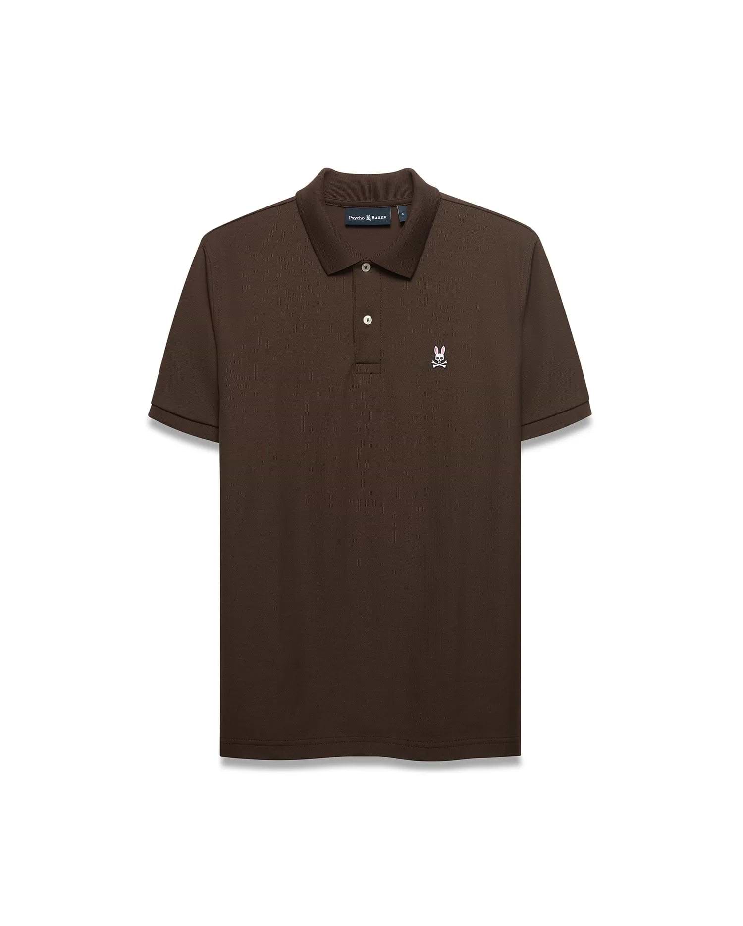 Men's Classic Pima Pique Polo in rich brown pique fabric, featuring a classic fit, two white buttons, and a small embroidered white and pink Psycho Bunny skull logo on the left chest. (1)