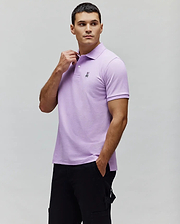 Mens Classic Pique Polo in lavender, featuring a classic fit, pique texture, and a small black embroidered Psycho Bunny skull logo on the left chest with a two-button placket. (1)