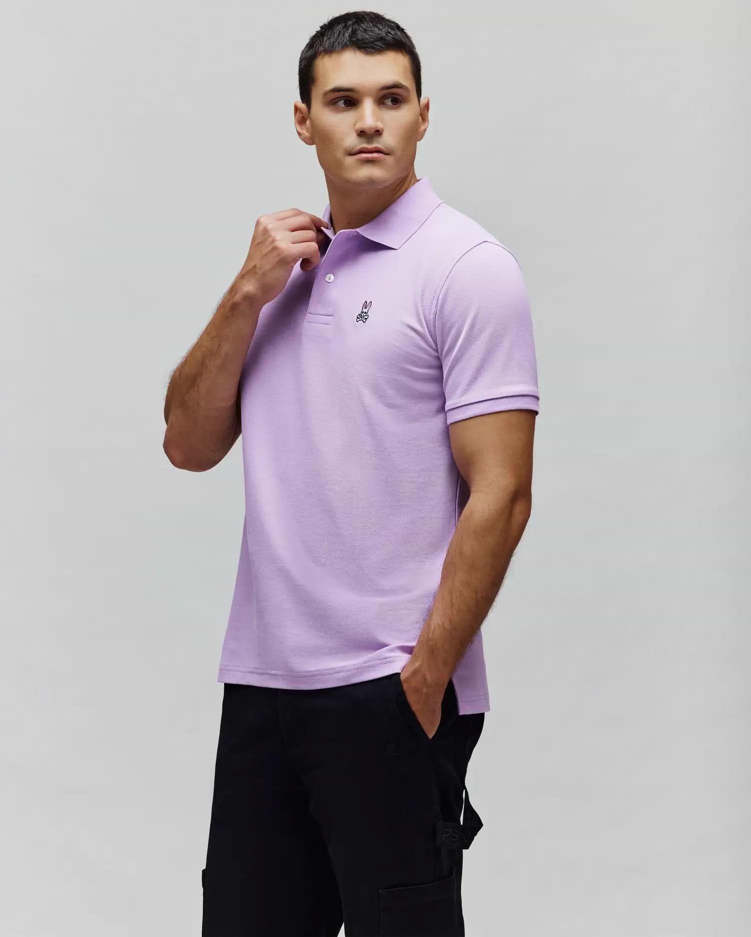 Mens Classic Pique Polo in lavender, featuring a classic fit, pique texture, and a small black embroidered Psycho Bunny skull logo on the left chest with a two-button placket. (1)