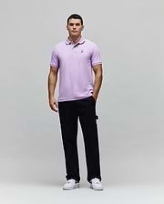Mens Classic Pique Polo in lavender, featuring a classic fit, textured pique fabric, and a small embroidered Psycho Bunny skull logo on the left chest. (4)