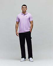 Mens Classic Pique Polo in lavender, featuring a classic fit, textured pique fabric, and a small embroidered Psycho Bunny skull logo on the left chest. (4)