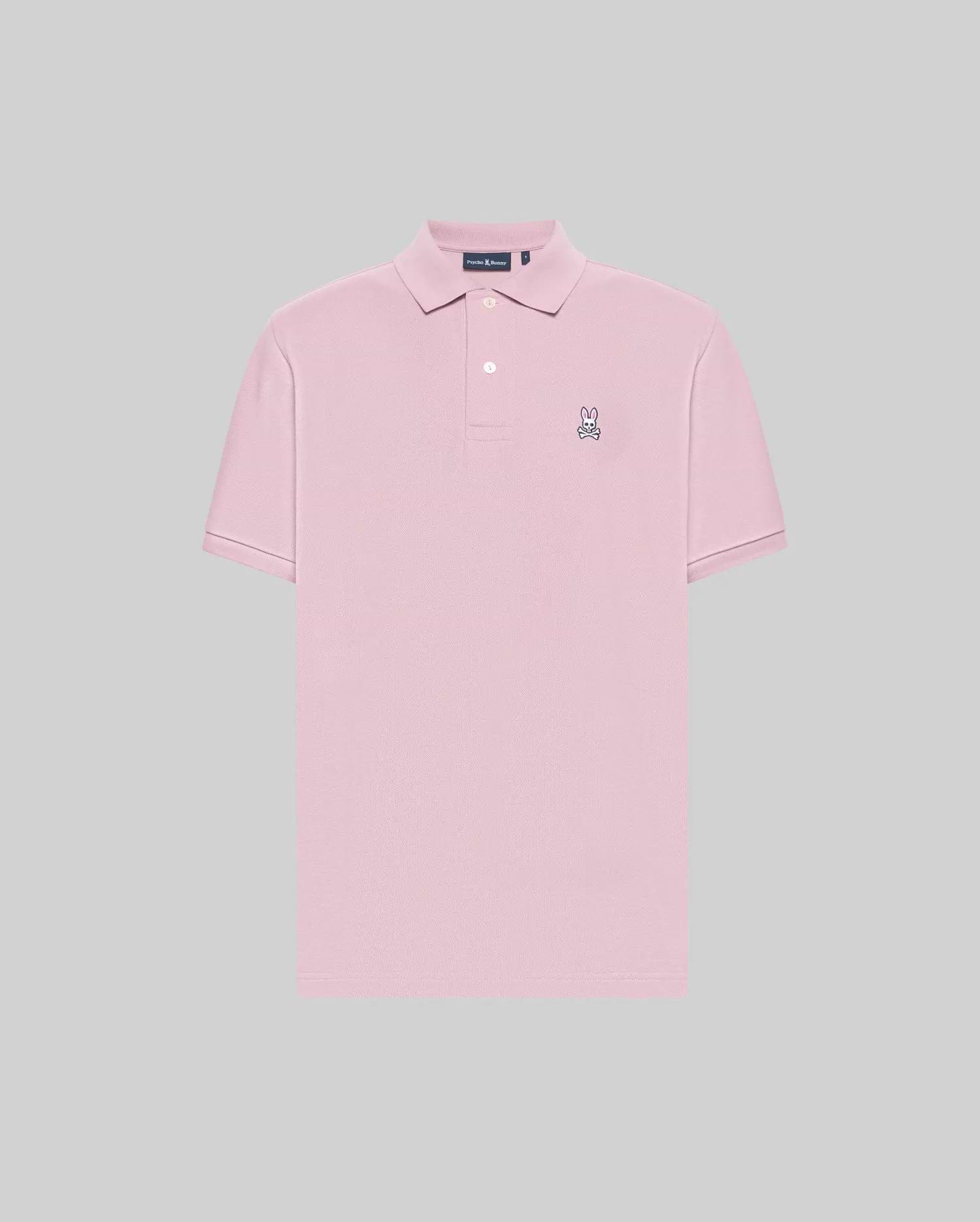 The Psycho Bunny MENS CLASSIC PIQUE POLO SHIRT - B6K001F200 is a light pink men’s short-sleeve polo made from soft Pima cotton, featuring a collar, two buttons, and an embroidered Bunny logo on the left chest. Solid light gray background.