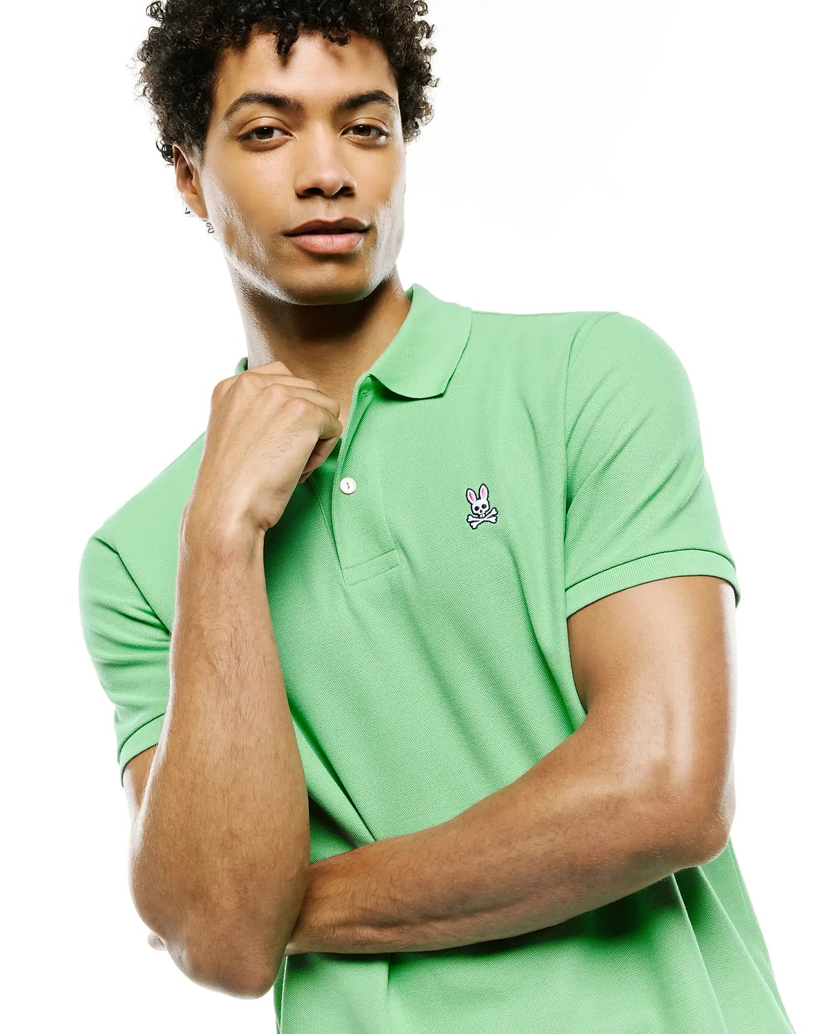 Mens Classic Pique Polo in vibrant lime green, featuring a classic fit, two-button placket with white buttons, and a detailed embroidered Psycho Bunny skull logo on the left chest.