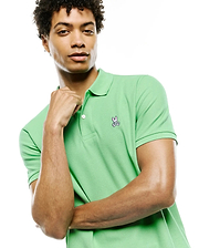 Mens Classic Pique Polo in vibrant lime green, featuring a classic fit, two-button placket with white buttons, and a detailed embroidered Psycho Bunny skull logo on the left chest.