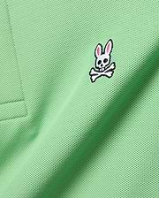 Mens Classic Pique Polo in vibrant light green, showcasing a detailed embroidered white, black, and pink Psycho Bunny skull logo on the left chest.