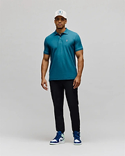 Mens Classic Pique Polo in vibrant teal pique fabric, featuring a classic fit, two-button placket, and a small white embroidered Psycho Bunny skull logo on the left chest. (5)