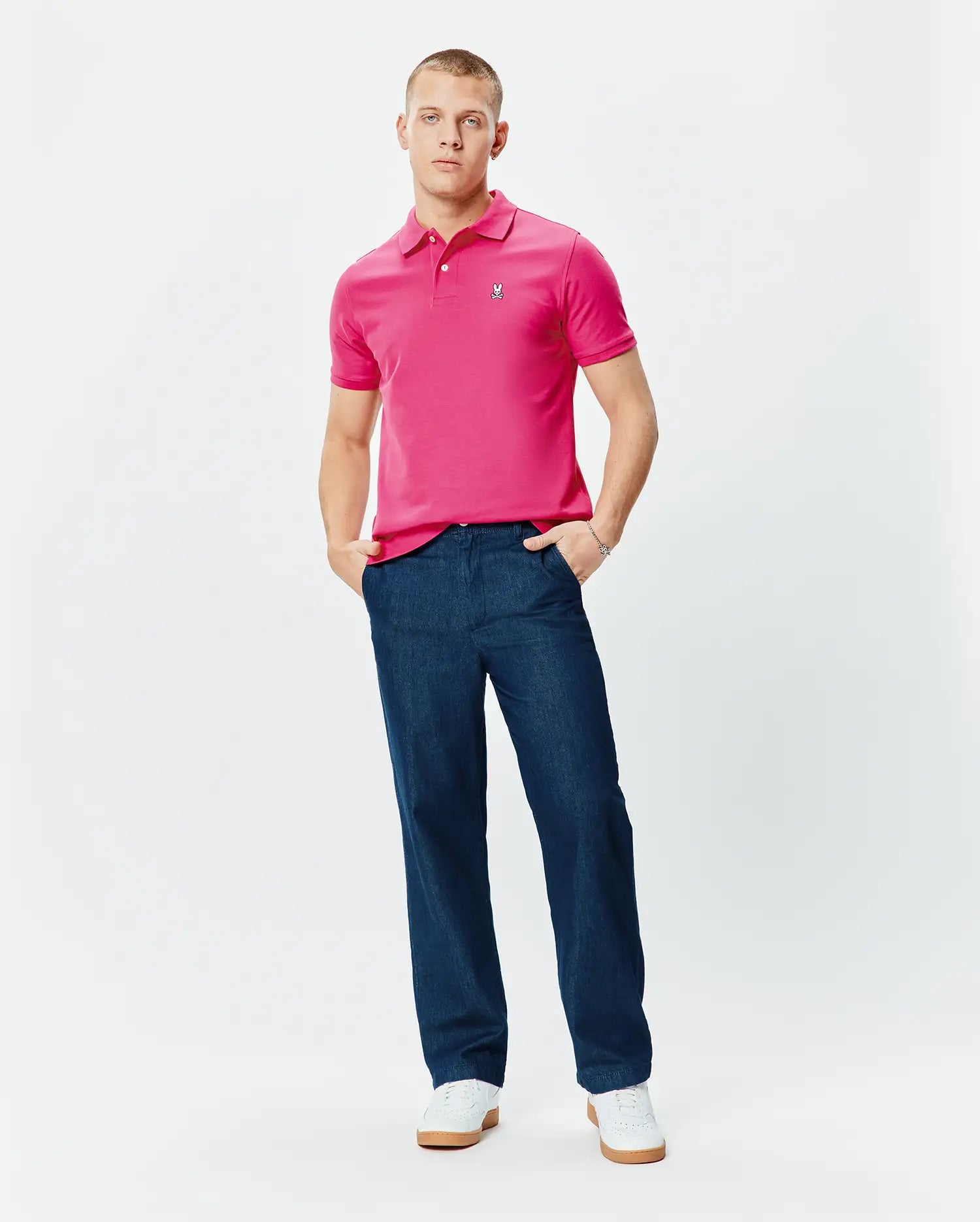 Mens Classic Pique Polo in vibrant fuchsia, featuring a classic fit, textured pique knit, and a small embroidered Psycho Bunny skull logo on the left chest. (5)