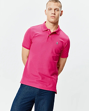 Bright pink Mens Classic Pique Polo, classic fit, pique knit, with two white buttons, ribbed collar and cuffs, and a small embroidered Psycho Bunny skull logo on the left chest. (1)