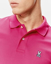 Mens Classic Pique Polo in vibrant pink pique knit, classic fit, with a two-button placket and small embroidered white and black Psycho Bunny skull logo on the left chest. (3)