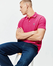 Mens Classic Pique Polo in vibrant fuchsia, featuring a classic fit, textured pique knit fabric, two white button placket, and a small embroidered white Psycho Bunny skull logo on the left chest. (4)