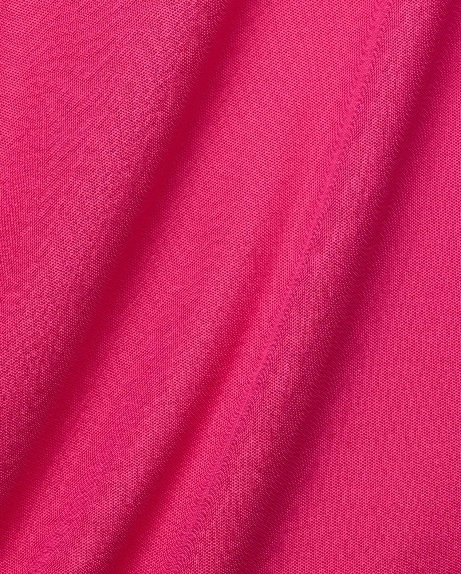 Vibrant fuchsia pink Mens Classic Pique Polo, a classic fit garment with a textured pique knit, featuring the iconic embroidered Psycho Bunny skull logo on the chest. (6)