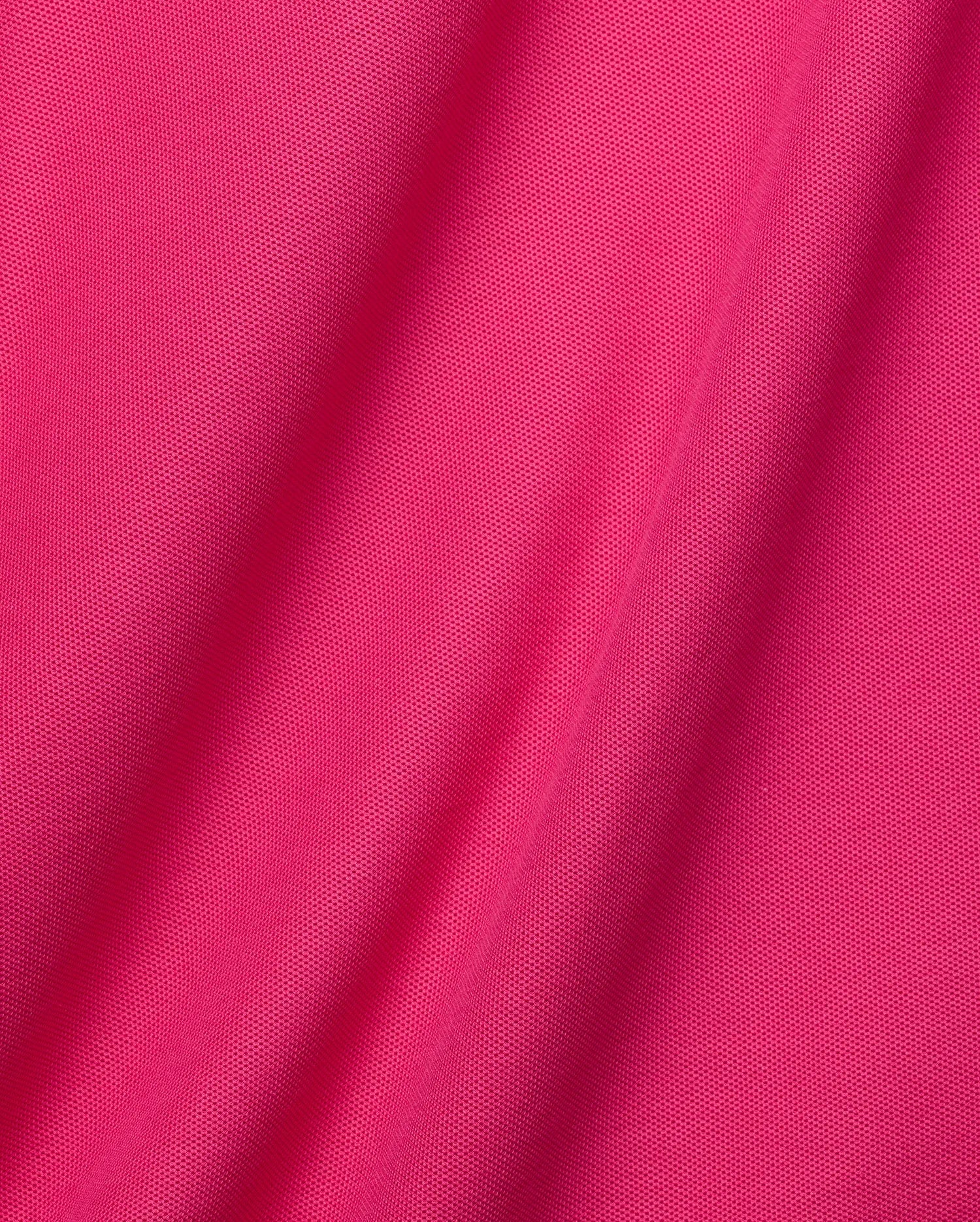 Vibrant fuchsia pink Mens Classic Pique Polo, a classic fit garment with a textured pique knit, featuring the iconic embroidered Psycho Bunny skull logo on the chest. (6)