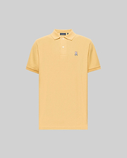 The Psycho Bunny MENS CLASSIC PIQUE POLO - B6K001F200 is a light yellow, short-sleeve Pima cotton polo with a collar, two buttons, and an embroidered Bunny logo on the left chest, set against a plain gray background. (1)