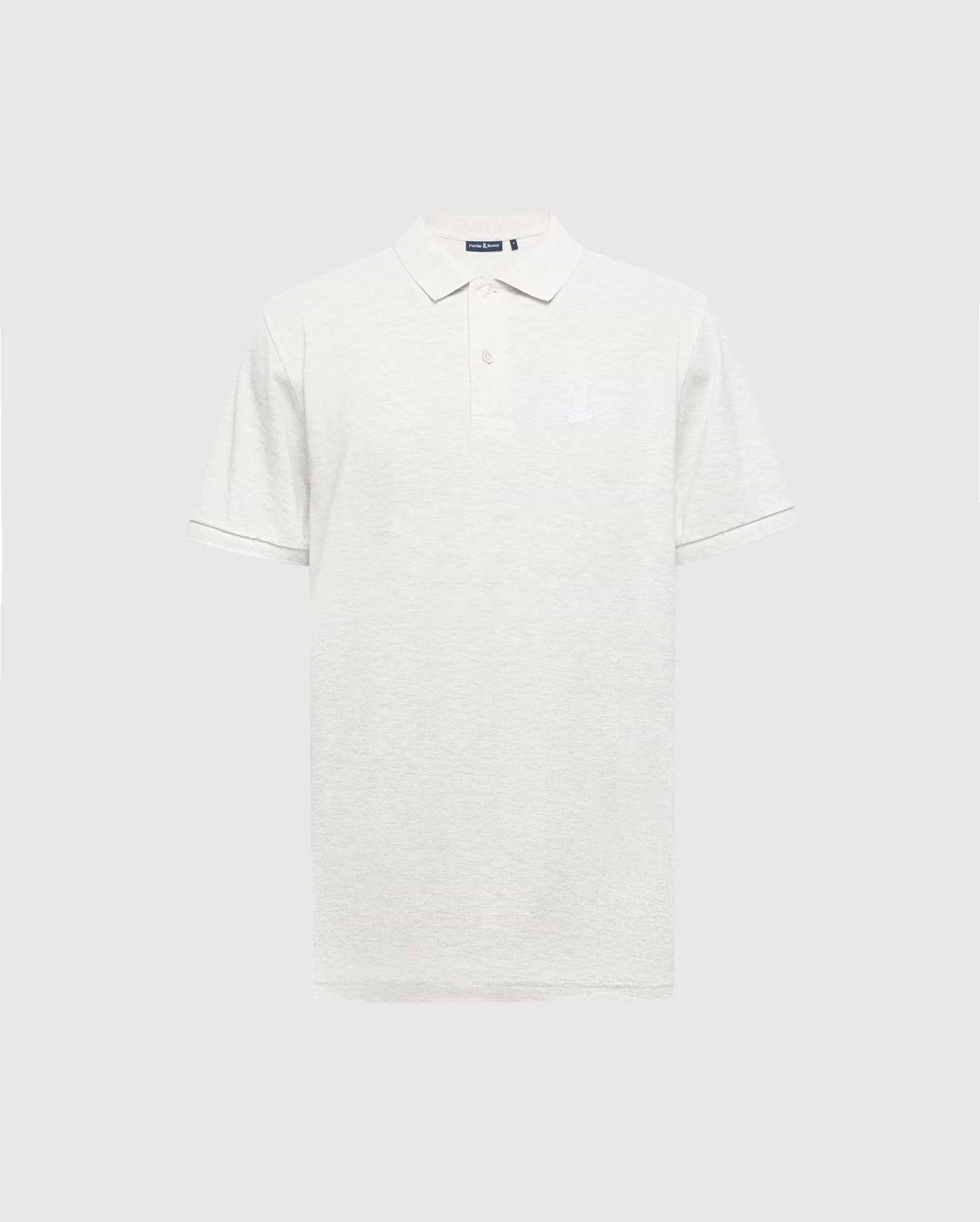 The Psycho Bunny MENS JAMES PIQUE POLO (B6K945D200) is a light gray, slim-fit polo made from soft Pima cotton. It boasts short sleeves, a collar, a three-button placket, and features a subtle embroidered logo on the left chest against a plain white backdrop.