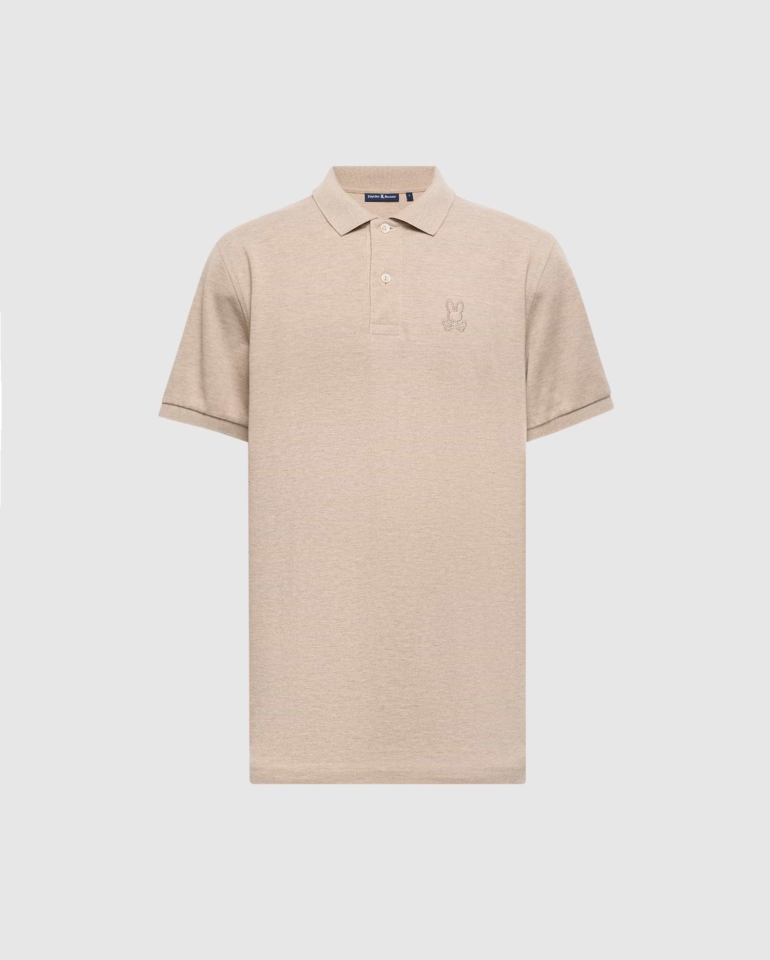 The MENS JAMES PREMIUM PIQUE POLO SHIRT - B6K945D200 by Psycho Bunny is a beige polo shirt, expertly crafted from durable Pima cotton. It features a subtle embroidered logo on the chest and is designed with short sleeves and a collar, offering a lightweight construction for a classic look set against a plain light gray background.