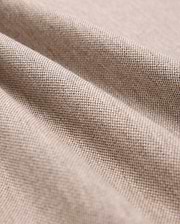 Close-up of beige Pima cotton fabric showcasing its fine weave and texture. The material is slightly draped, forming gentle folds that highlight its softness and quality, making it look ideal for crafting a durable Psycho Bunny MENS JAMES PREMIUM PIQUE POLO SHIRT - B6K945D200.