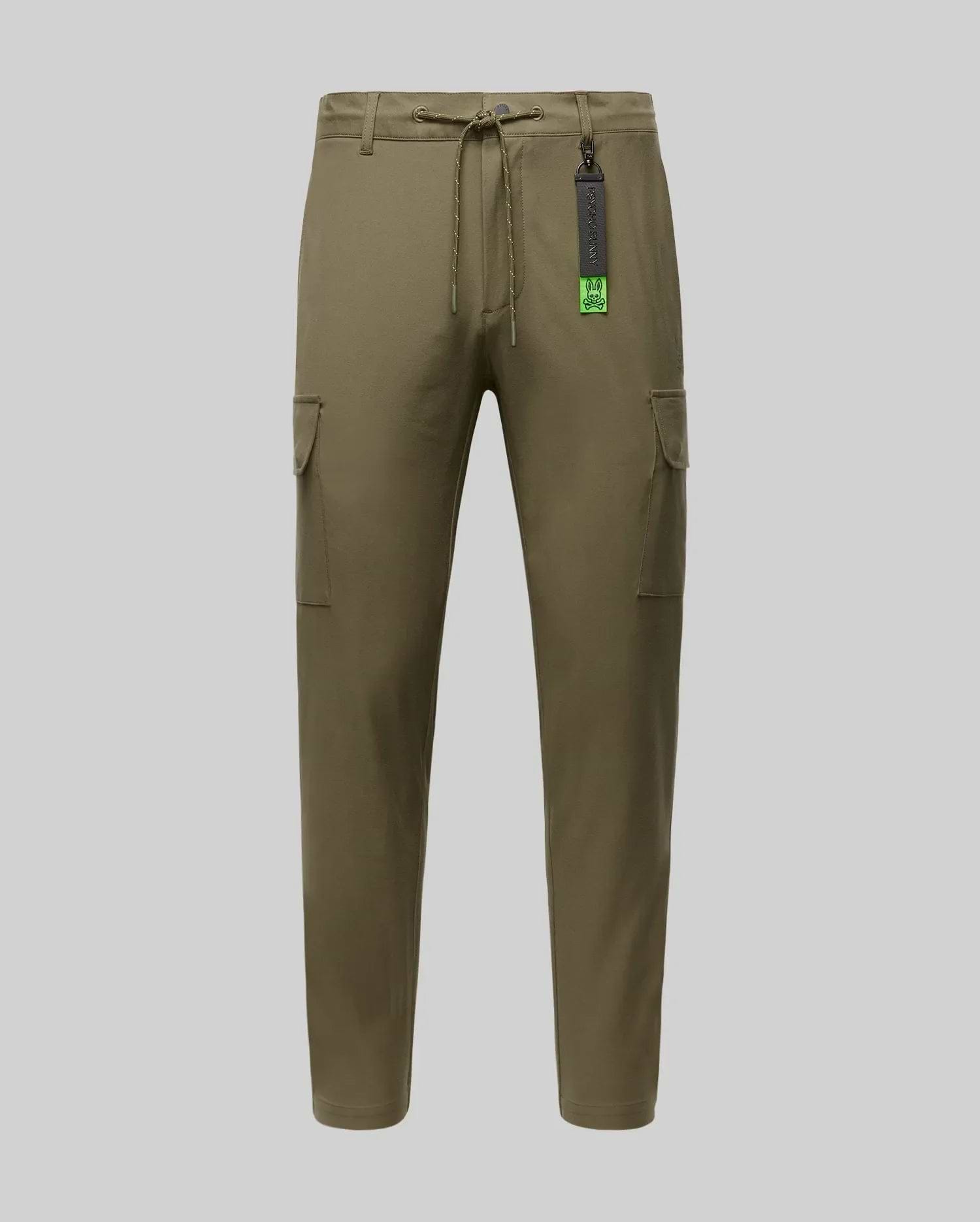 The Psycho Bunny MENS LLOYD CARGO JOGGER (B6P159B200) features khaki green fabric, a drawstring waist, side pockets, and a black tag near the waistband, shown on a plain light grey background.