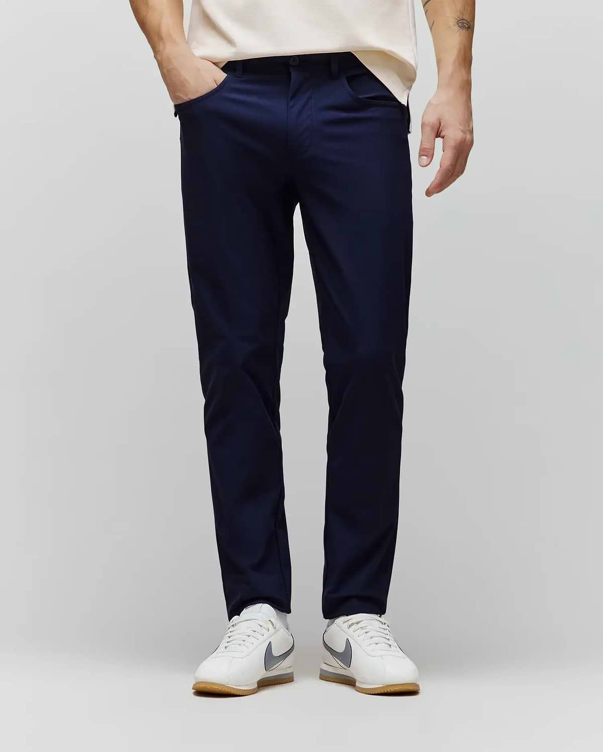 Mens Maverick 10k Step Pant in deep navy, a slim-fit performance pant crafted from smooth, refined fabric, featuring subtle side pockets for a sleek, modern streetwear aesthetic. (1)