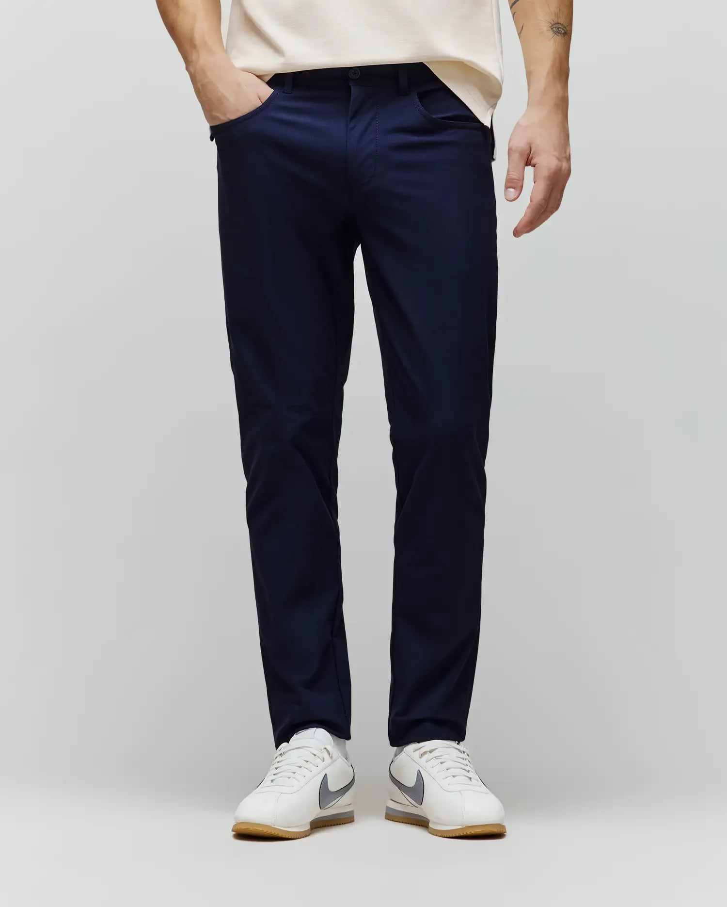 Mens Maverick 10k Step Pant in deep navy, a slim-fit performance pant crafted from smooth, refined fabric, featuring subtle side pockets for a sleek, modern streetwear aesthetic. (1)
