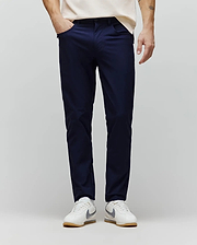Mens Maverick 10k Step Pant in deep navy, a slim-fit performance pant crafted from smooth, refined fabric, featuring subtle side pockets for a sleek, modern streetwear aesthetic. (1)