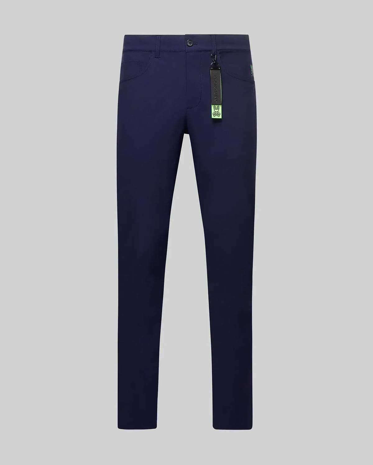 Mens Maverick 10k Step Pant in navy blue, a slim-fit style with smooth performance fabric, featuring a small neon green embroidered Psycho Bunny skull logo on the front pocket and a vibrant brand tag. (5)