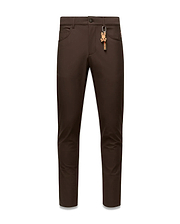 Brown Mens Maverick 10k Step Pant, slim fit, featuring a small red embroidered Psycho Bunny logo on the right front pocket and a prominent brown and orange skull keychain on the left belt loop. (5)