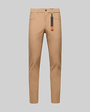 The Psycho Bunny MENS MAVERICK 10K STEP PANT - B6P788D200 is shown in slim-fit tan, featuring four-way stretch, front and back pockets, belt loops, and a black tag with an orange accent on the front belt loop against a gray background.