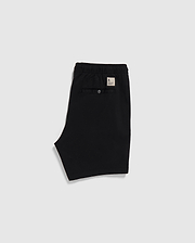 Black Psycho Bunny eco-friendly shorts with an elastic waistband and a label on the back, displayed on a plain white background.