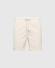 The MENS WILLIS STRETCH TENCEL SHORT in cream by Psycho Bunny features a Stretch Tencel™ blend with an elasticized waistband and drawstring closure, set against a plain gray background, perfect for effortless casual style.