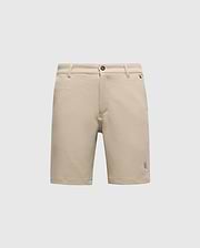 The Psycho Bunny MENS SHIRO KNIT HONEYCOMB SHORT (B6R585F200) is a beige, honeycomb-patterned piqué short with belt loops, front button and zipper closure, and a small embroidered logo near the left hem, shown on a white background.