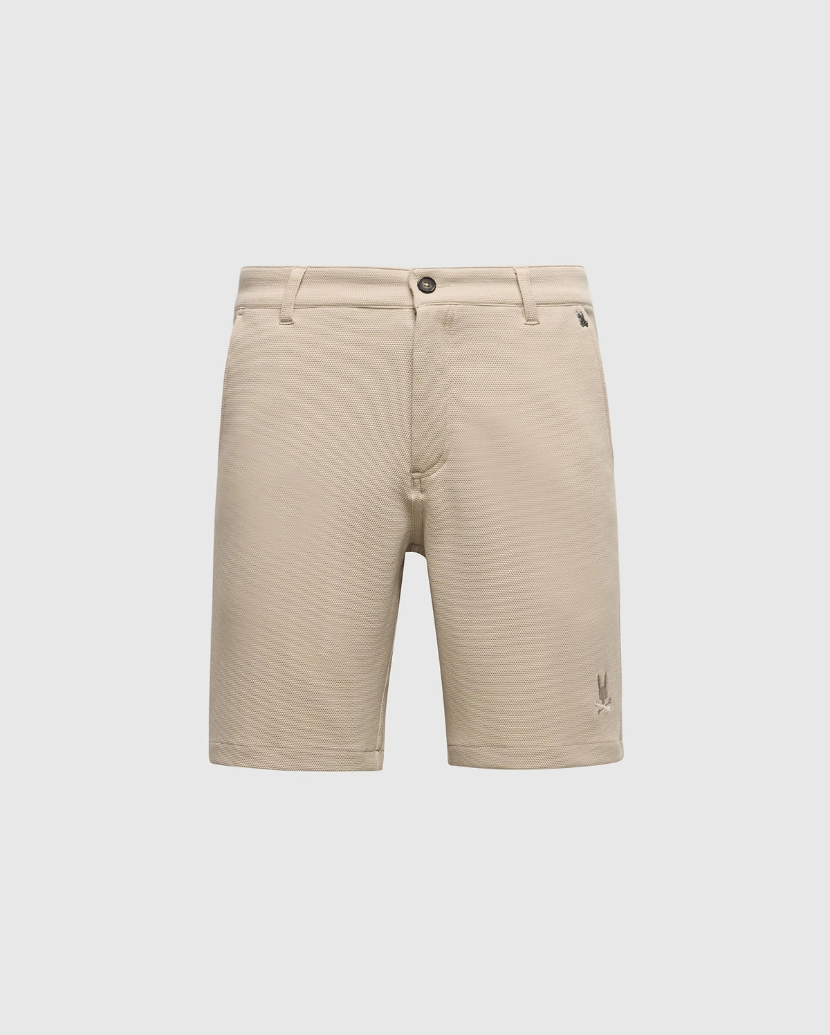 The Psycho Bunny MENS SHIRO KNIT HONEYCOMB SHORT (B6R585F200) is a beige, honeycomb-patterned piqué short with belt loops, front button and zipper closure, and a small embroidered logo near the left hem, shown on a white background.