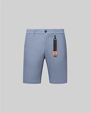 Mens Maverick 10k Step Short in light blue, featuring a smooth performance fabric, classic fit, flat front, and a distinctive black and orange Psycho Bunny keychain with bunny skull logo and brand text.