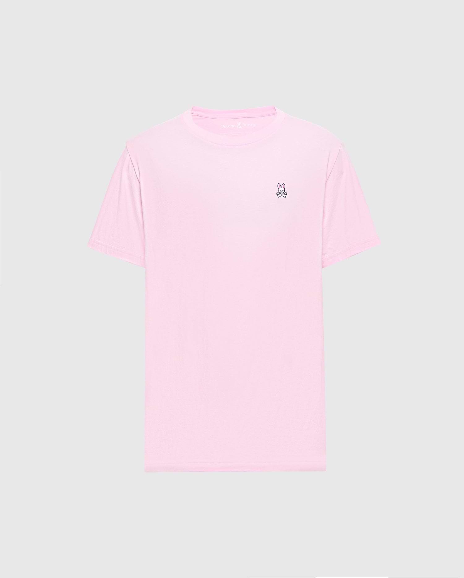 The Psycho Bunny MENS CLASSIC CREW NECK TEE - B6U014CRPC features a light pink color with short sleeves and a small embroidered peace sign on the upper left. Made from soft Pima cotton in a regular fit, it's shown on a plain gray background.