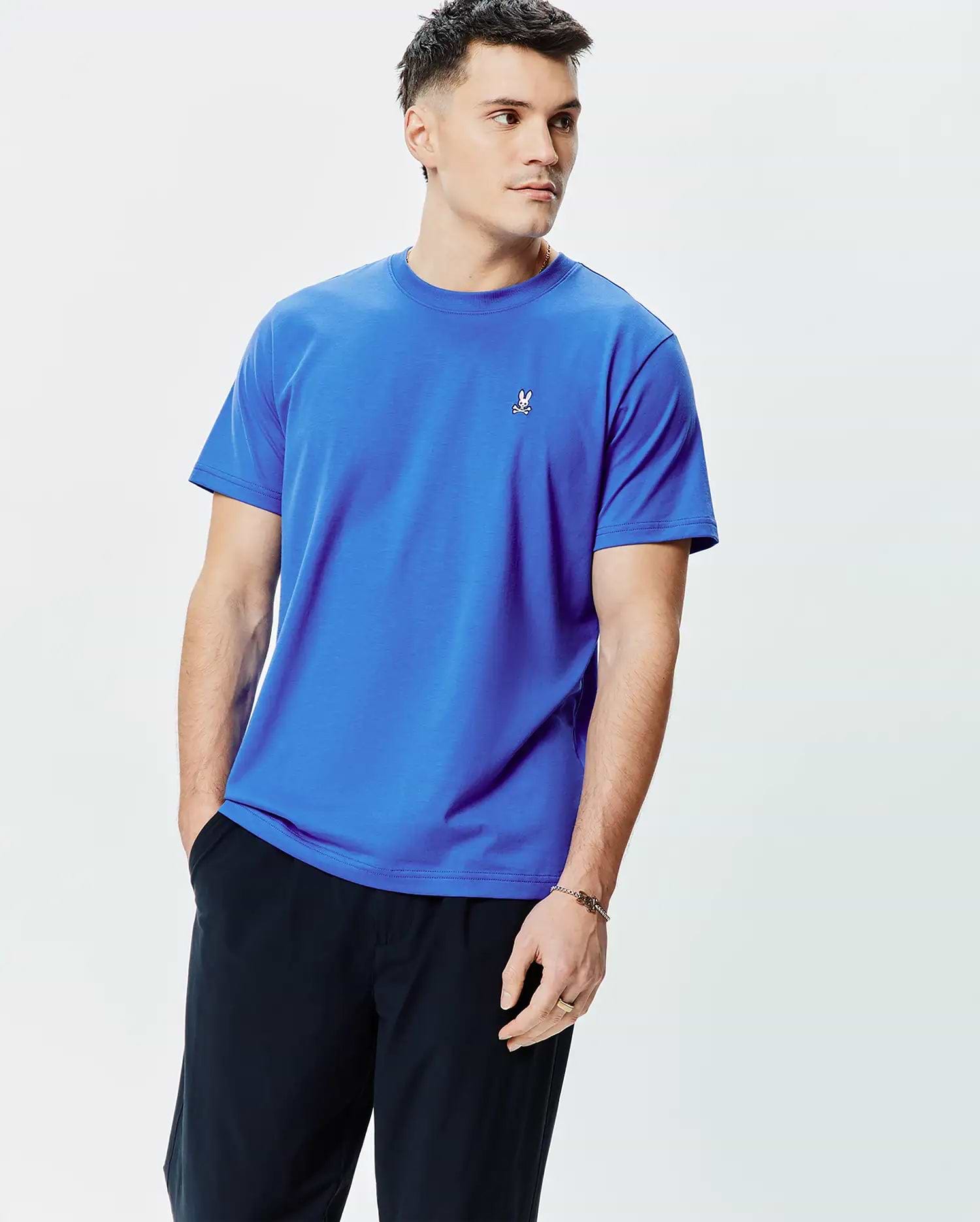 Mens Classic Crew Neck Tee in vibrant royal blue, crafted from smooth jersey knit with a classic fit, featuring a small embroidered white, black, and red Psycho Bunny skull logo on the left chest.