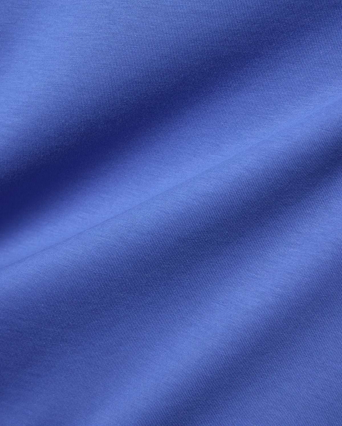 Mens Classic Crew Neck Tee in a vibrant blue, premium jersey fabric, showcasing its smooth, soft texture and refined drape, perfect for refined streetwear.