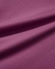 Mens Classic Crew Neck Tee in a luxurious, soft plum-colored jersey knit fabric, featuring subtle folds that highlight its smooth texture and rich, vibrant hue, embodying premium Psycho Bunny style.