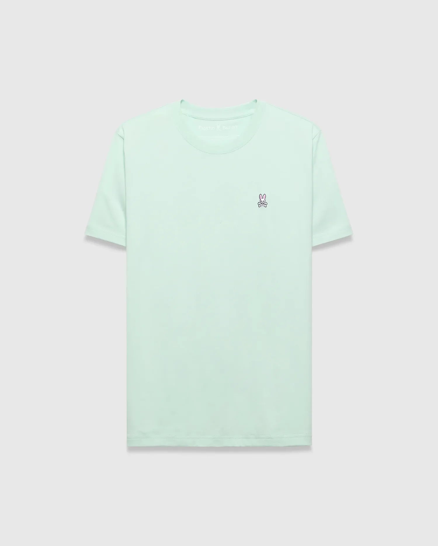 Mens Classic Crew Neck Tee in mint green, featuring a classic fit and smooth jersey knit. Small embroidered pink, white, and black Psycho Bunny skull logo on the left chest. (2)