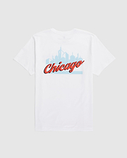 Psycho Bunny's MENS CHICAGO CITY TEE (B6U551W1PC) is a white Pima cotton shirt showcasing a light blue Chicago skyline with "Chicago" in bold, red cursive.
