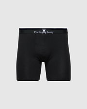 The Psycho Bunny MENS SOLID KNIT 2 PACK BOXER BRIEF (B6V906ARCM) features black stretch knit, a fitted design, soft Pima cotton, and a black waistband with "Psycho Bunny" and bunny logo in white on the front. Plain light gray background.