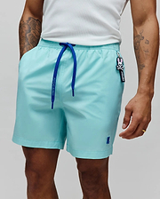Mens Samos Hydrochromic Printed Swim Trunk, relaxed aqua with royal blue Psycho Bunny drawstrings, small embroidered blue bunny skull logo on left leg, and a Psycho Bunny skull keychain.
